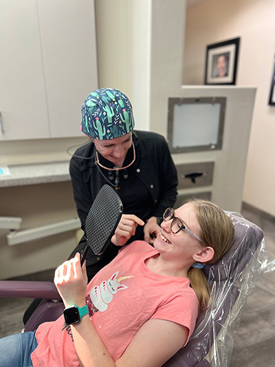 young girl receiving invisalign orthodontics at Scottsdale Dental Arts