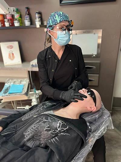 dentist giving patient periodontal therapy at Scottsdale, AZ dental office